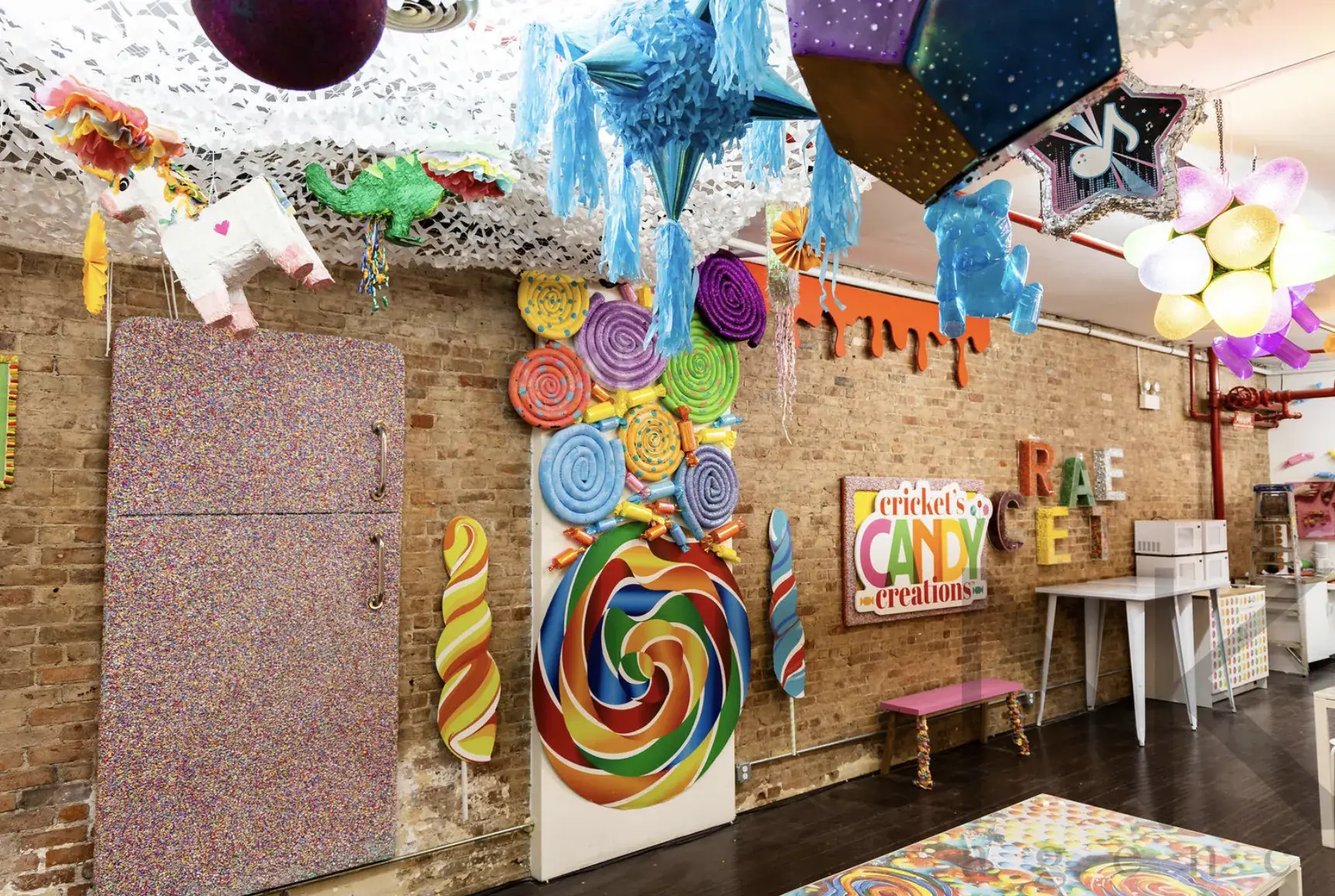 Cricket's Candy Creations party studio with pinatas and candy art