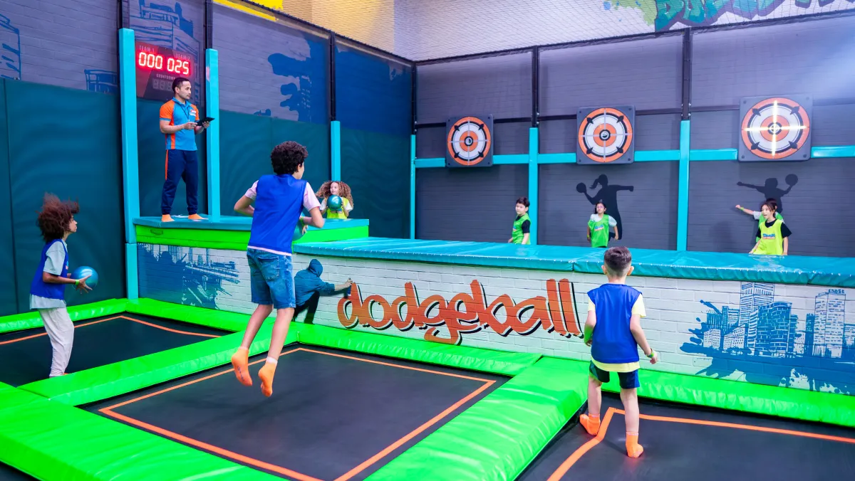 Kids playing dodgeball on trampolines at Trampo UAE