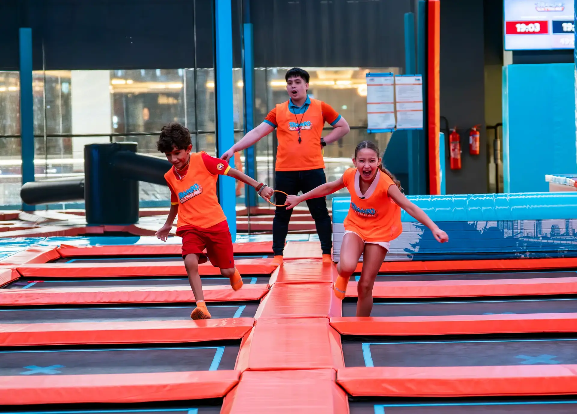 Kids running on trampolines