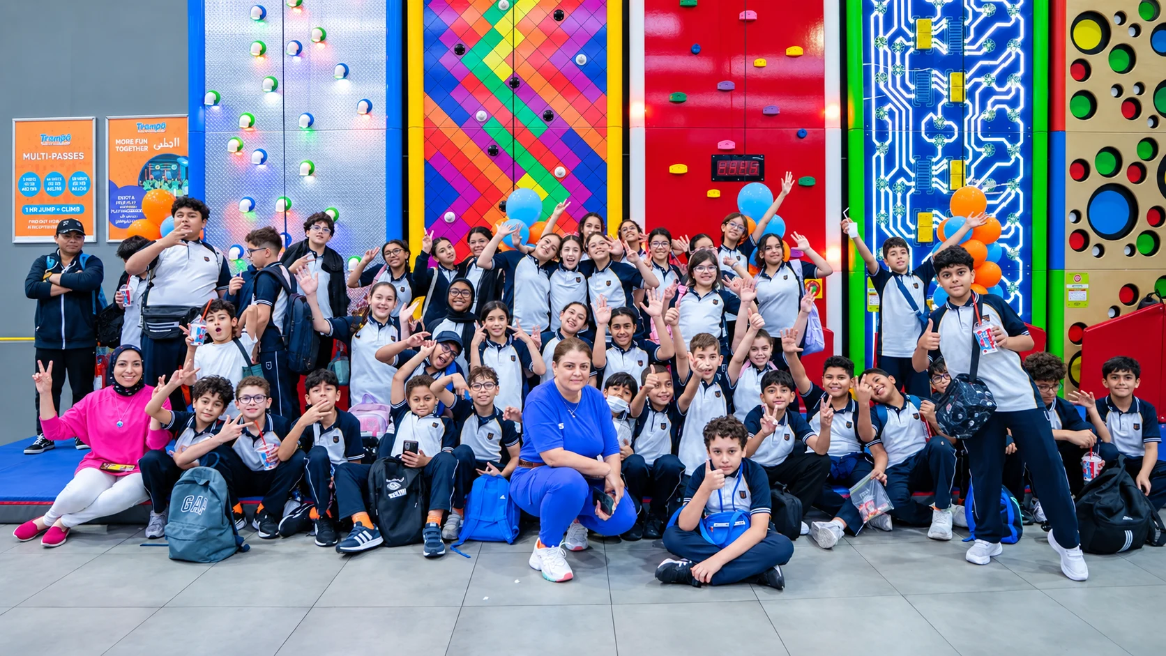 Students and teachers on a school trip at Trampo
